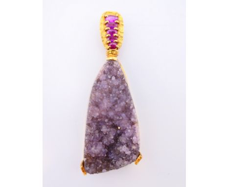 An 18 ct gold, ruby and amethyst pendant.  Pendant 6.5 cm high. 