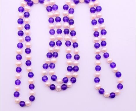 A string of amethyst and pearl beads.  Approximately 120 cm long. 