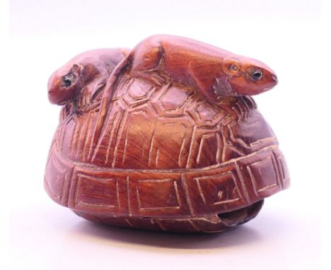 A netsuke in the form of rats on a tortoise shell. 4 cm long.