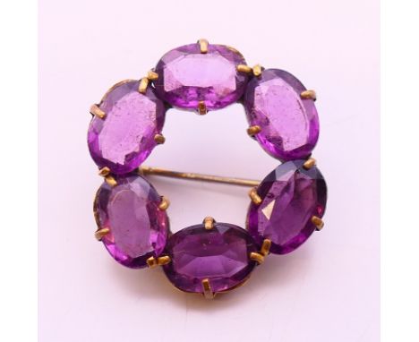 An amethyst brooch.  2.5 cm diameter. 