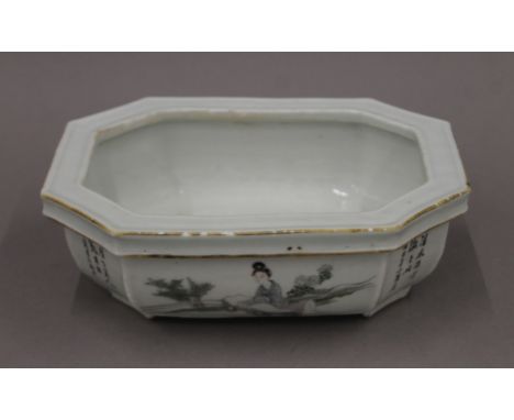 A 19th century Chinese porcelain planter painted with calligraphy and figures. 21 cm wide.