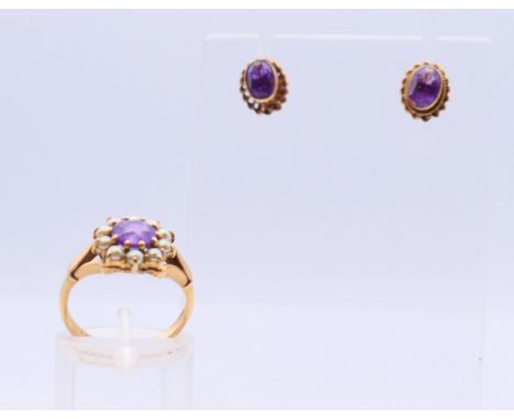 A 9 ct gold amethyst and seed pearl ring and pair of earrings. Ring size J/K.