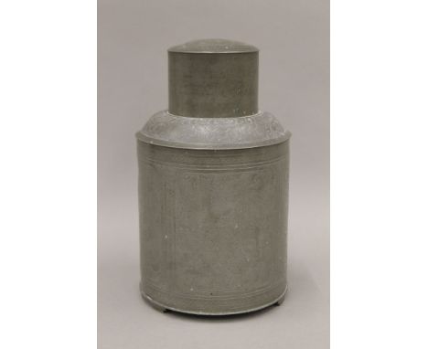 A 19th century Chinese cylindrical pewter tea canister and cover decorated with panels of flowers and a pheasant, seal marks 
