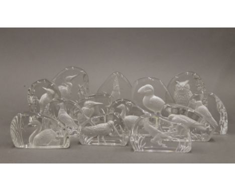 A collection of Wedgwood crystal intaglio bird paperweights and one other glass paperweight of a puffin marked ICELAND. The l