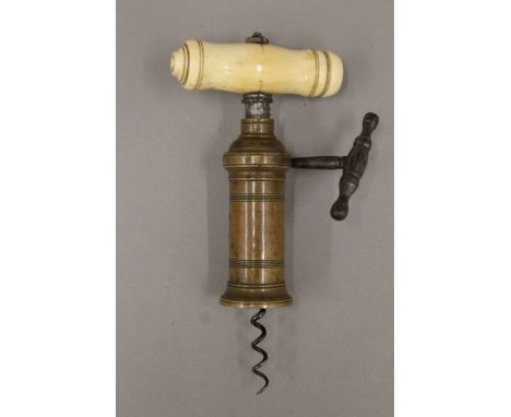 An early 19th century corkscrew with bone handle, stamped 'Verinder'. 19 cm high.
