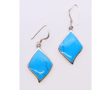A pair of silver and turquoise earrings.  2.5 cm high. 
