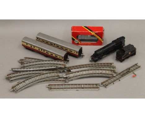 A small quantity of Hornby 00 gauge rolling stock and track. The engine 19 cm long.