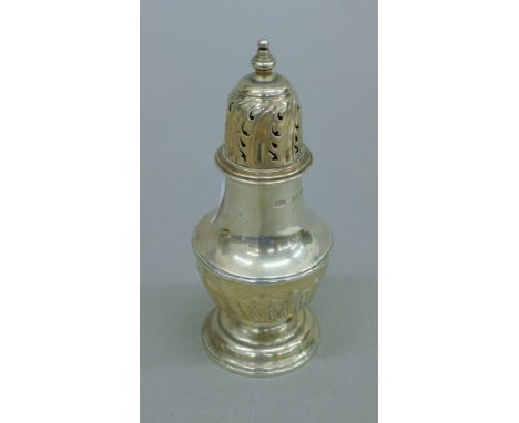 A silver pepper caster. 11 cm high. 69.7 grammes.