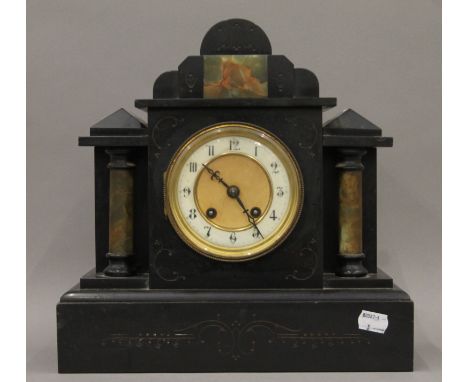 A Victorian black slate and onyx mantle clock. 31 cm wide.