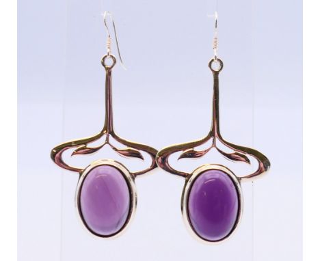 A pair of silver Art Nouveau-style amethyst earrings.  5 cm high. 