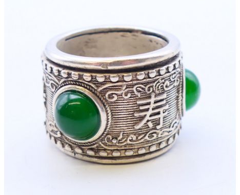 A silver and jade archer's ring.  2.25 cm high. 
