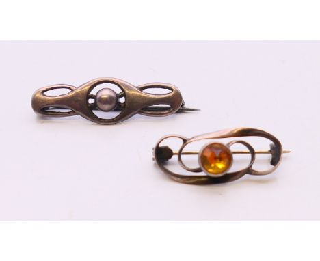 Two silver Charles Horner brooches.  3 cm and 2.5 cm wide respectively.