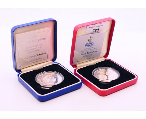Two boxed silver proof £5 coins, boxed with certificates.