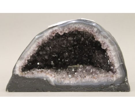 A small amethyst geode. 20 cm wide.