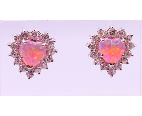 A pair of silver heart-shaped earrings. 1.5 cm high.