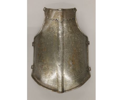 A 19th century Persian breast plate decorated with various figures, animals and calligraphy. 44 cm high.