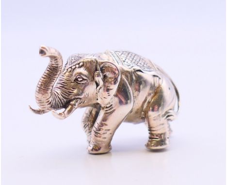 A solid silver model of an elephant.  2.75 cm high, 18.2 grammes. 
