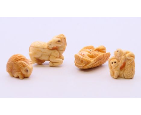 Four bone carvings including two netsuke. The largest 3.2 cm high.