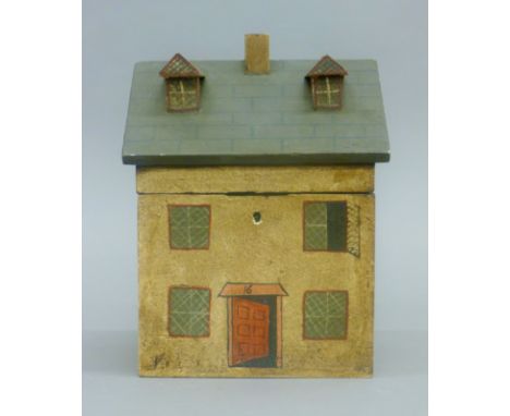 A wood tea caddy in the form of a house. 21.5 cm high.