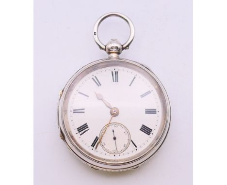 A silver cased open face pocket watch. 5 cm diameter. 