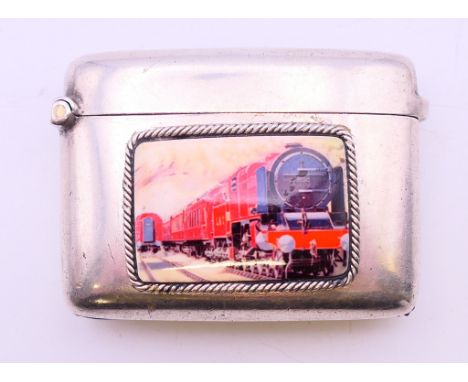 A silver vesta with steam train panel. 5 cm wide.