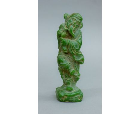 A model of a deity. 18 cm high.