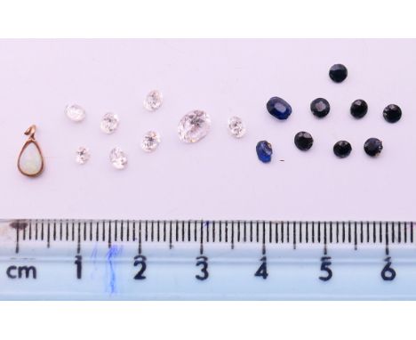 A quantity of gemstones including diamonds, sapphires, opal etc.
