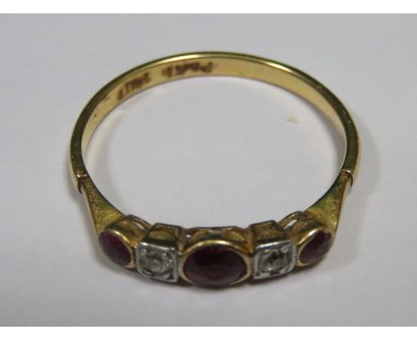 18ct GOLD AND PLATINUM SET DRESS RING WITH CLEAR STONES AND RUBY COLOURED STONES 