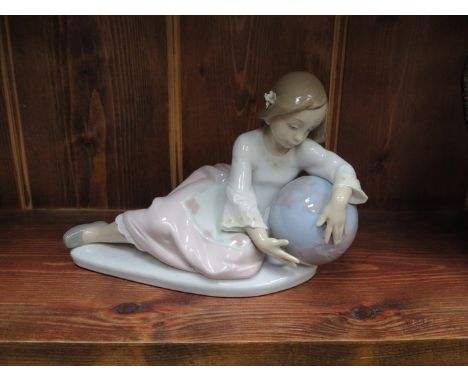 LLADRO GLAZED CERAMIC FIGURE OF A RECLINING LADY WITH GLOBE