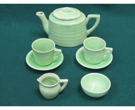 SEVEN PIECE GREEN CERAMIC CHILD'S TEA SET 