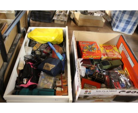 Two boxes of diecast model cars, board games, a cycle kit of tools, and other items 