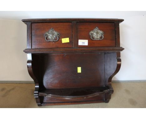 A mahogany shelf rack, with two drawers to the top 