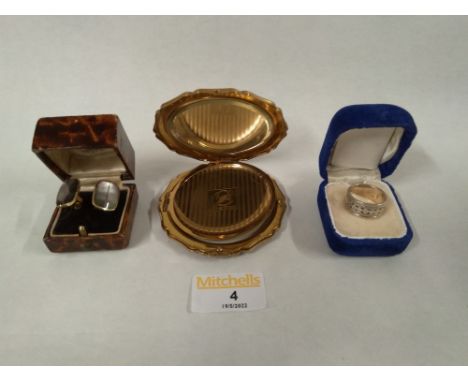 White metal 925 grade ring, a pair of metal cufflinks with stones, and a Stratton compact
