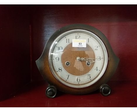 A vintage oak cased mantle clock with two train movement