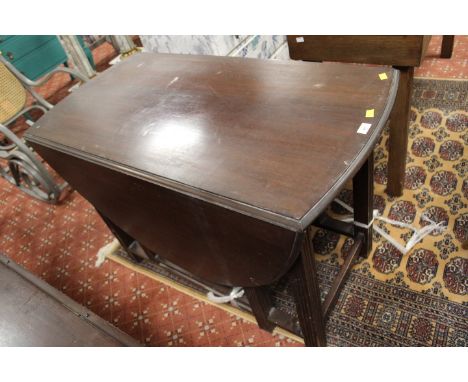 A 20th century mahogany drop leaf table with gate leg 