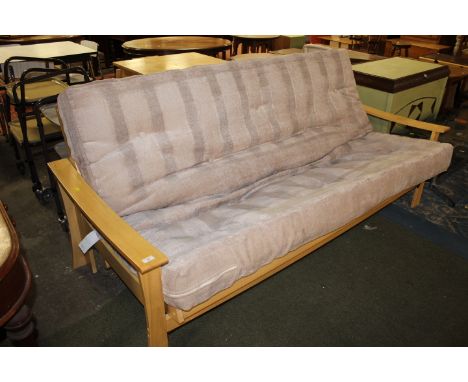 A grey beech framed sofa bed 