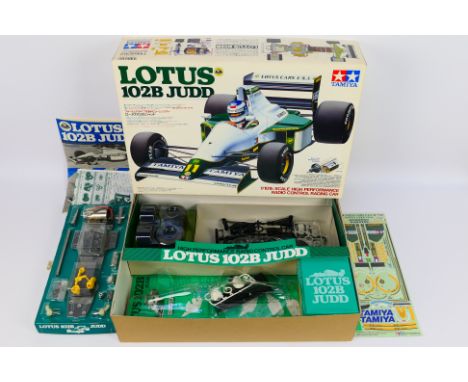 Tamiya - A boxed vintage 1991 Tamiya #58095 1:10 scale Lotus 102B Judd High Performance RC car kit. The kit has unpainted bod