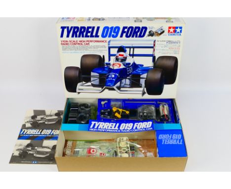 Tamiya - A boxed vintage 1990 Tamiya #58090 1:10 scale Tyrrell 019 Ford High Performance RC car kit. The kit has unpainted bo