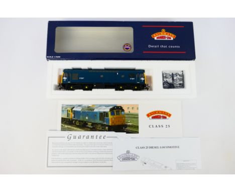Bachmann - A boxed OO gauge Class 25/3 Diesel locomotive number D7667 in BR blue livery # 32-404. The model appears Mint in a
