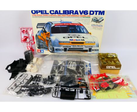 Tamiya - A boxed vintage 1995 Tamiya #58150 1:10 scale electric Opel Calibra V6 DTM 4WD High Performance Racing Car kit with 