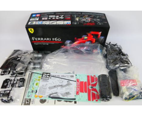 Tamiya - A boxed 2009 Tamiya #58447 1:10 scale electric 'Ferrari F60' RC car kit. The kit has unpainted body shell, plus loos
