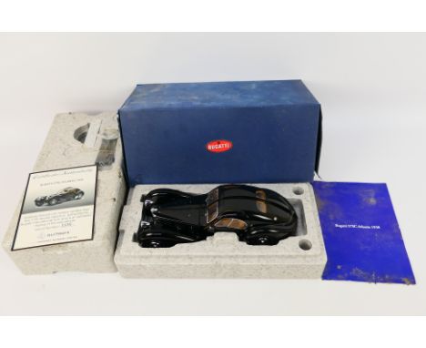 AutoArt - A boxed 1:18 scale AutoArt #70941 Bugatti 57SC Atlantic 1938. The model in black appears to be in Excellent conditi