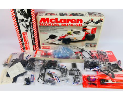 Kyosho - A boxed vintage 1990 Kyosho #4202 1:10 scale McLaren Honda MP4/5B electric powered RC kit. The kit contains, body sh