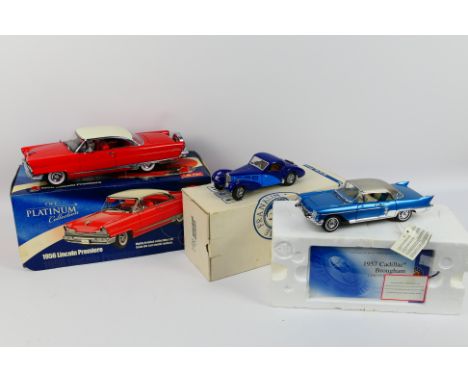 Sun Star - Franklin Mint - Three partially boxed diecast model vehicles. Lot consists of a Franklin Mint 1:24 Bugatti Type 59
