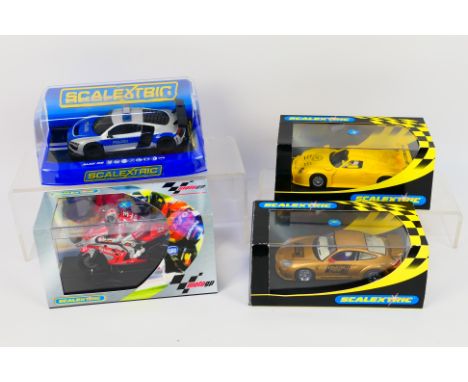 Scalextric - Four boxed Scalextric slot models. Lot consists of C6017 Moto GP Marco Melandri Tech 3 Yamaha; C3374 Audi R8 Pol