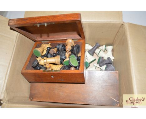 A box containing chess sets and cribbage boards