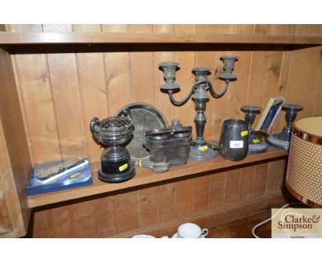 A quantity of various silver plated items to include binoculars in case; a candelabra; tankards; a hip flask; cutlery etc.