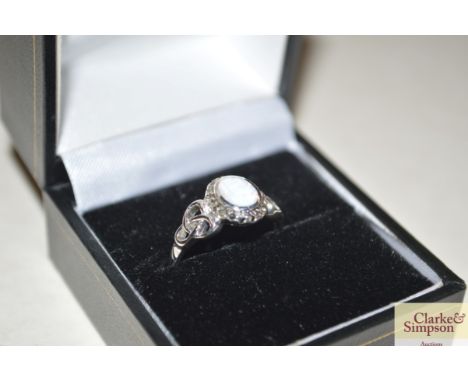 A boxed silver and opal ring 