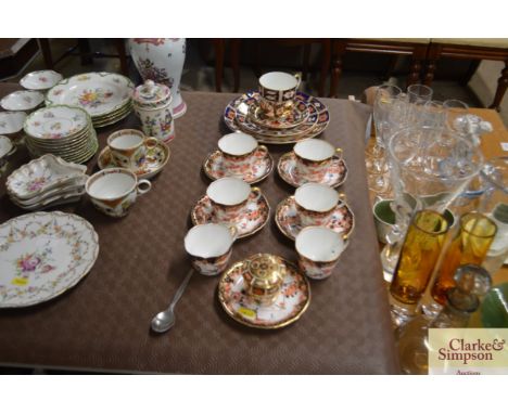 A quantity of gilt decorated Royal Crown Derby cups and saucers; and a quantity of Old Imari pattern Crown Derby