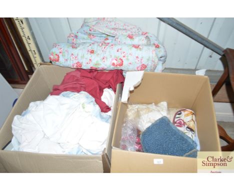 Two boxes containing various linen and curtains etc